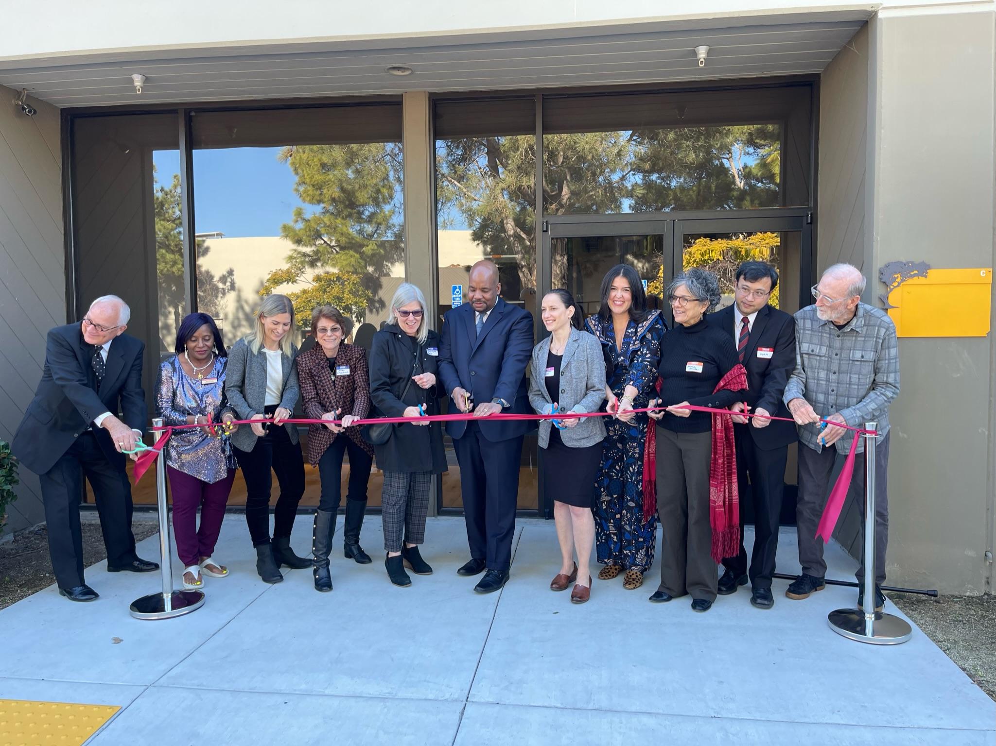 Group of people at Bastyr University San Diego cutting a ribbon