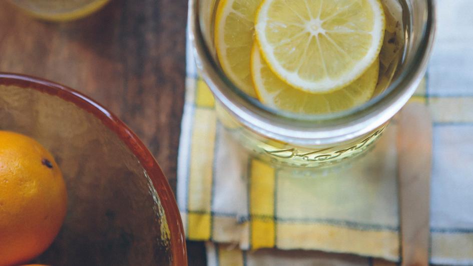 lemon water, honey wand, and oranges