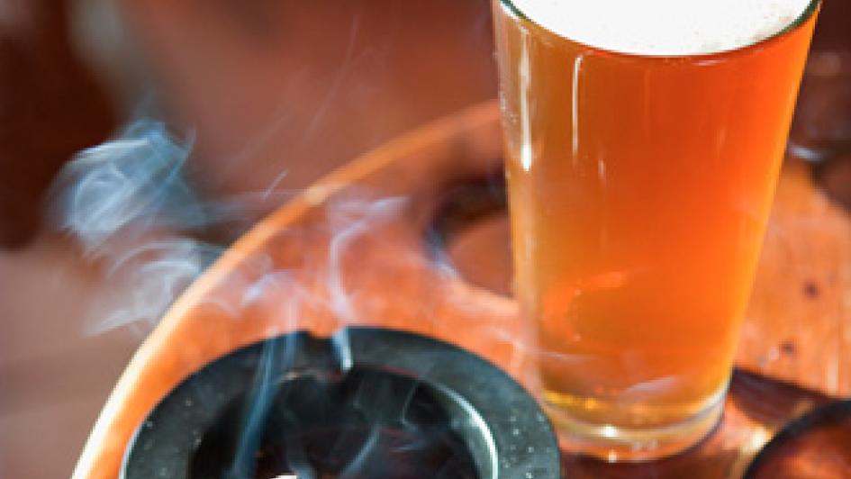 smoking cigarette and beer on table