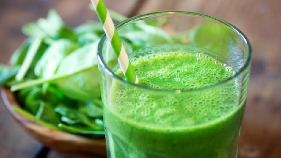 green smoothie with leafy vegetables in a bowl