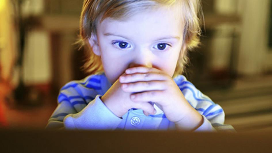 child looking at a screen