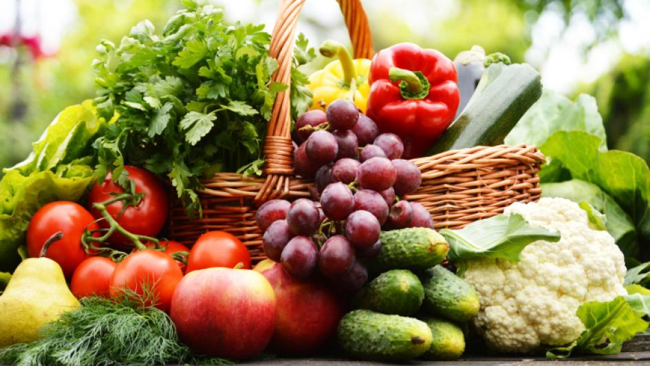 basket overflowing with fruits and vegetables