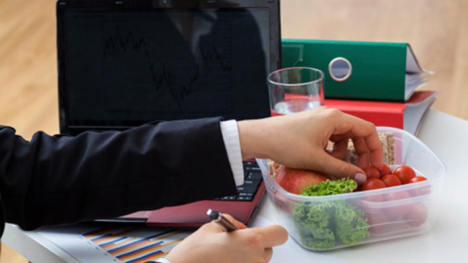 person grabbing food from a lunch to-go container