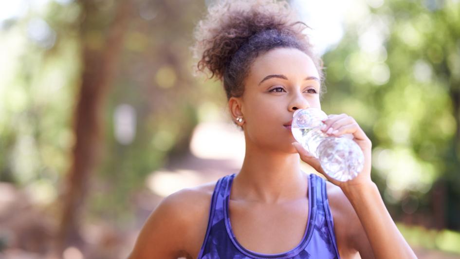 person drinking a bottle of water