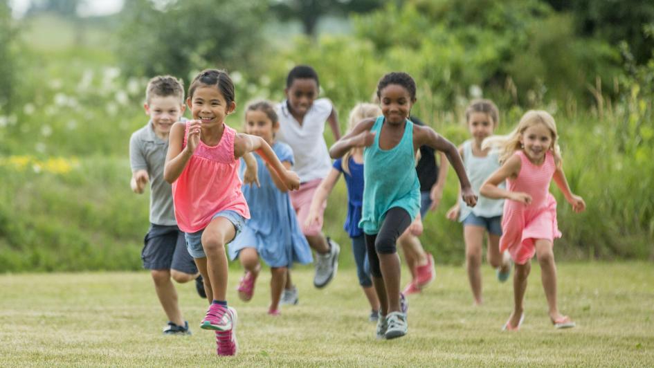 9 children running in a field