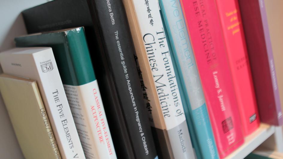 stack of traditional Chinese medicine books