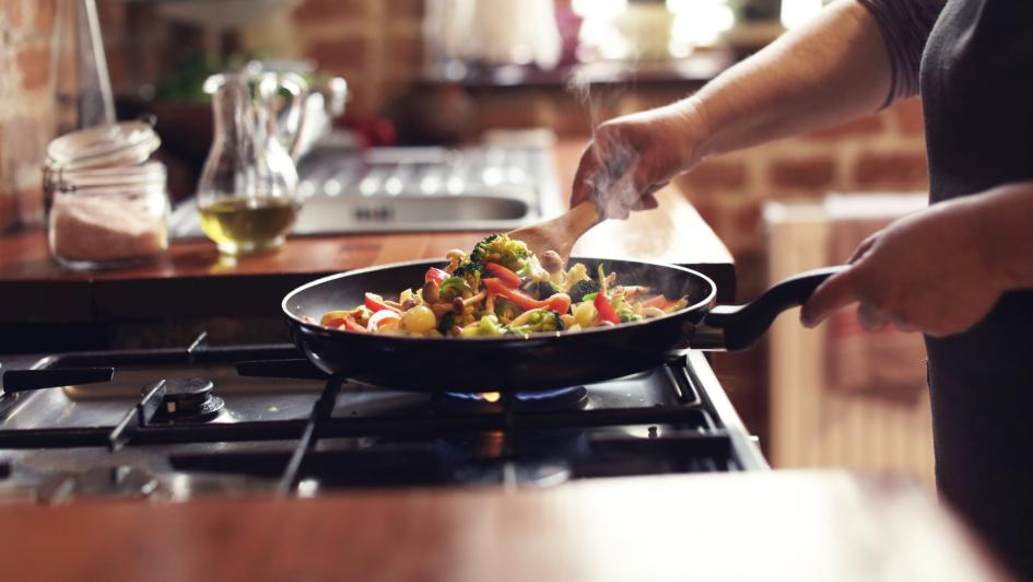 someone cooking stirfry