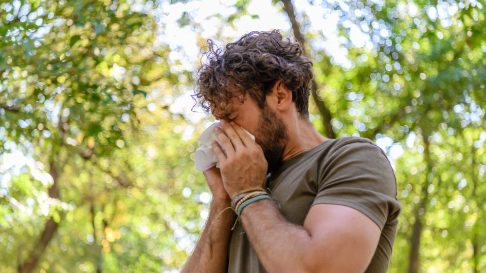 person in park with allergies