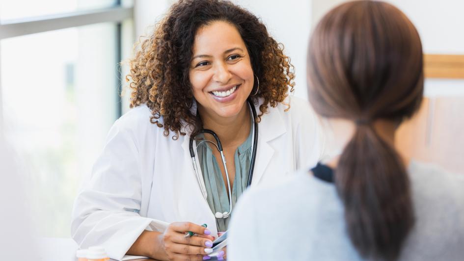 doctor speaking to patient smiling